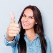 image of Woman holding her arm out with a thumbs up