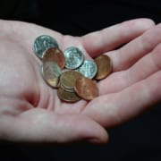 image of hand with coins