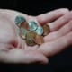 image of hand with coins