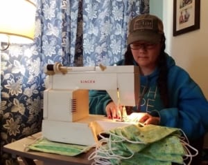 photo of Natco employee using sewing machine