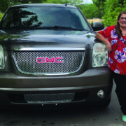 photo of member with her new vehicle