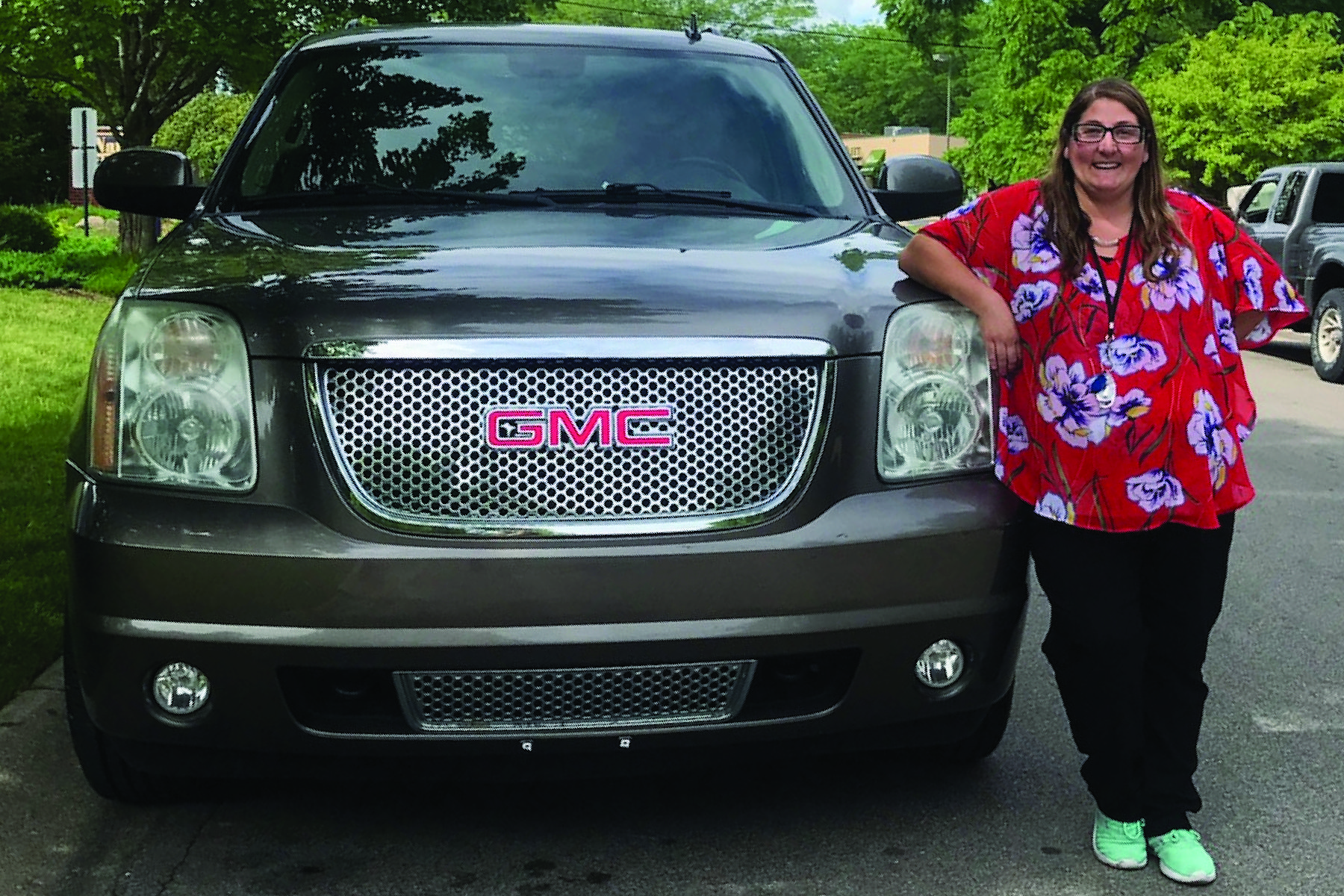 photo of member with her new vehicle