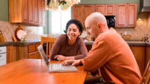 Couple looking at laptop