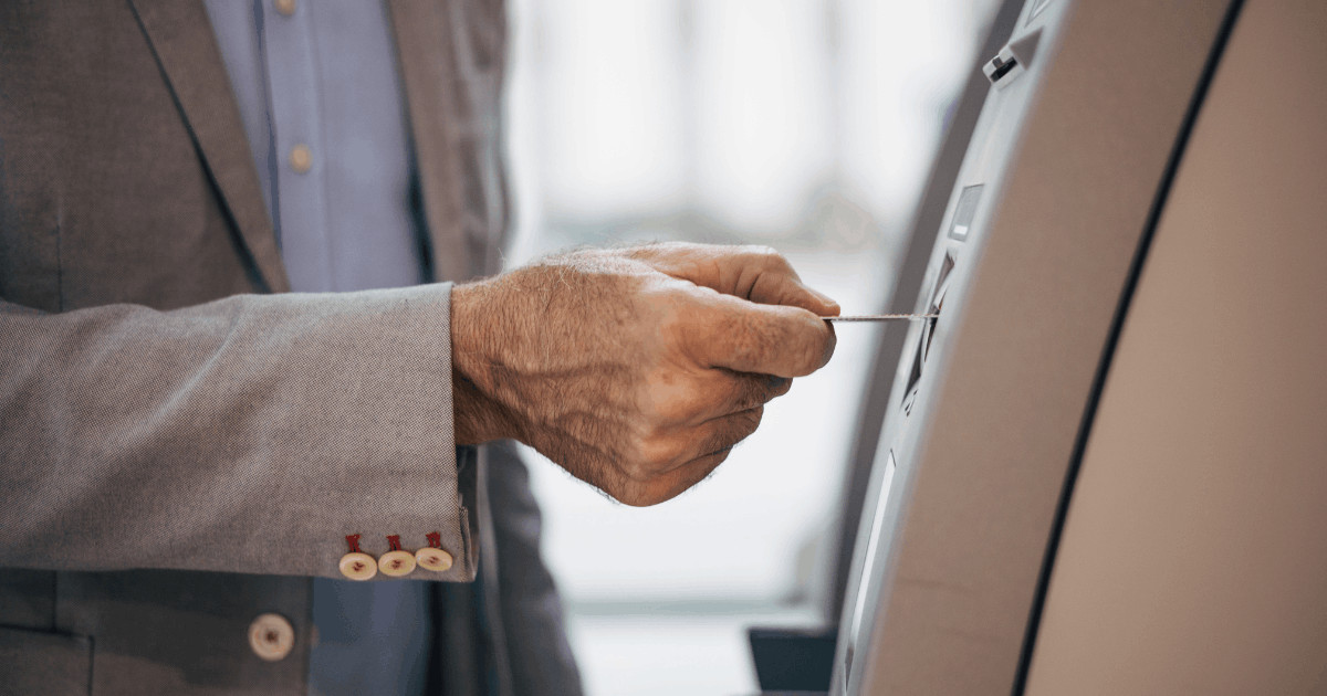 close up of elderly person usting atm