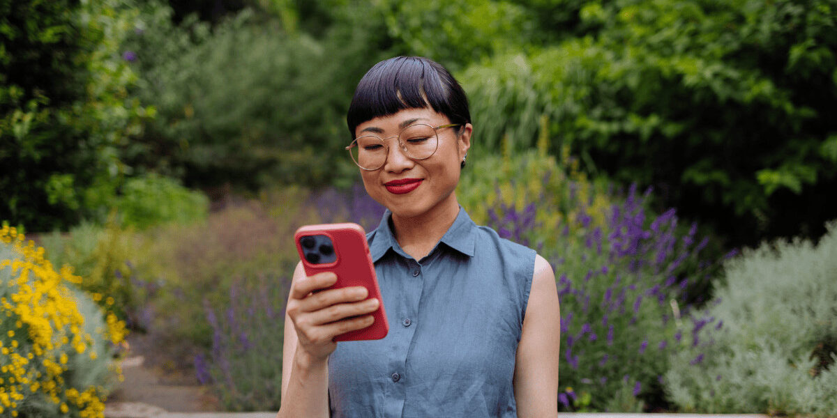 woman looking confidently at phone
