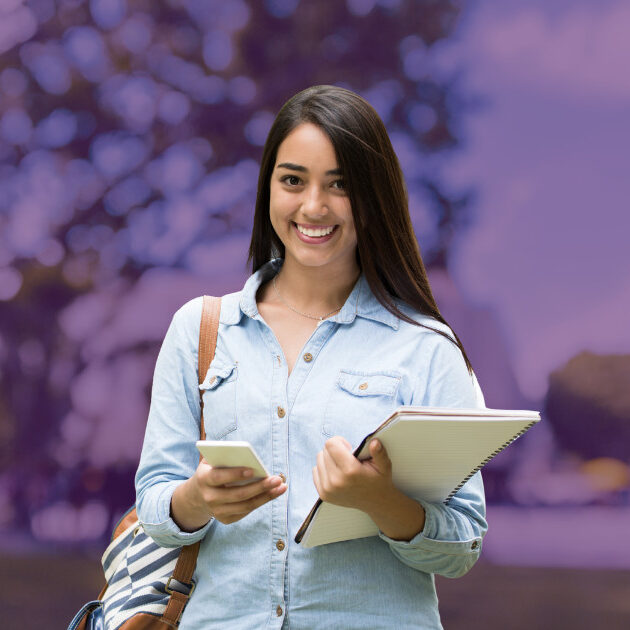 student with notebook and cell phone