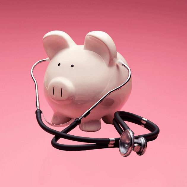 piggy bank listening to stethoscope on isolated background